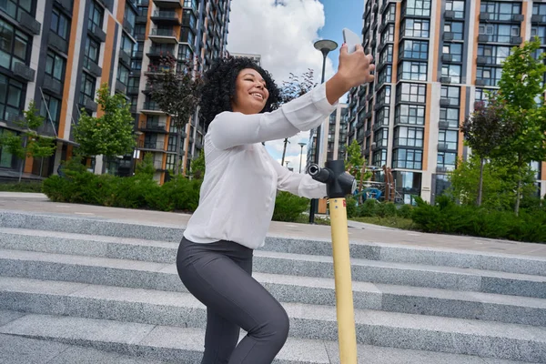 Happy Young Woman Takes Photo Herself Scooter Backdrop High Rise — ストック写真