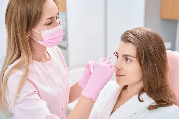 Relaxed Lady Sitting Front Beautician While Doctor Doing Cosmetic Procedure — Foto Stock