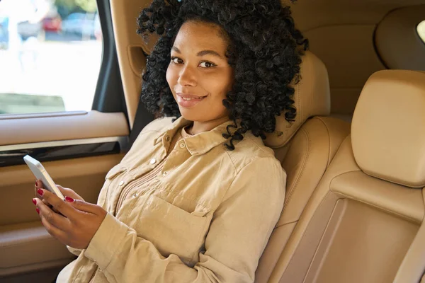 Cute Mixed Race Female Travels Comfortably Back Seat Car She — Zdjęcie stockowe