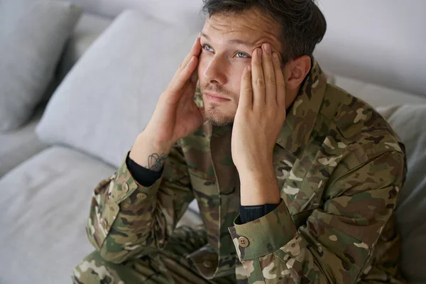 Army Man Rubbing His Temples Looking While Suffering Psychological Problems — 图库照片