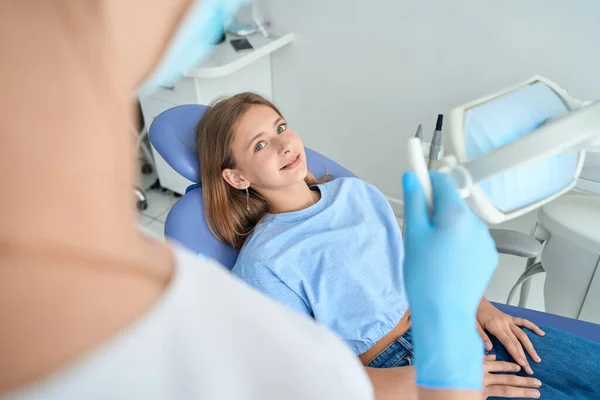 Teenage Patient Lying Chair Looking Stomatologist Dental Device — Zdjęcie stockowe