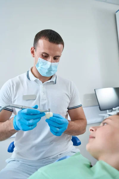 Experienced Male Doctor Adjusting Ceramic Crown Young Patient Applying Dental — ストック写真