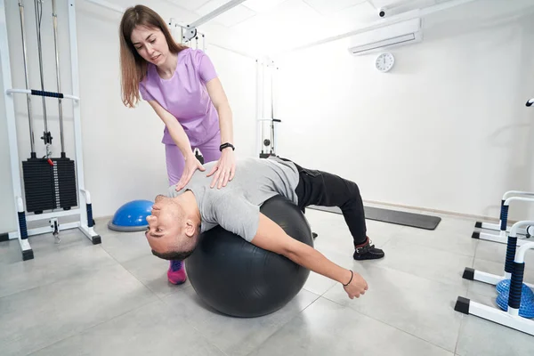 African American Man Lying Gym Exercise Ball While Having Kinesiotherapy — Photo