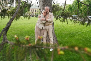 Happy woman caressing her partner while having date outdoors