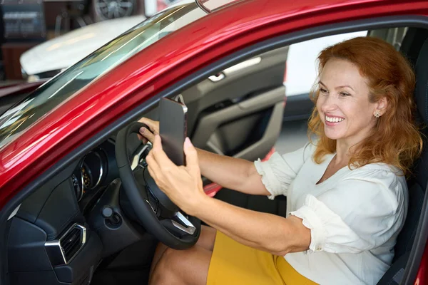 Smiling Woman Taking Photo Smartphone New Red Auto — Stock Photo, Image
