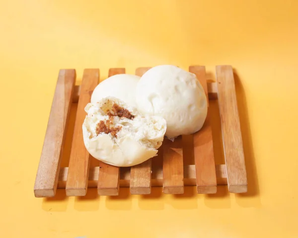 Bakpao bread for a healthy breakfast menu. It is highly recommended to eat the buns that are still hot. Bakpao usually has various fillings such as nuts and chocolate. Chinese specialties. Focus blur.