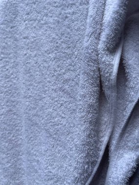 Güneşe maruz kalmış bir havlu bezi motifi. Warp yumuşak kumaş motifi. Renkli kumaşlar model tasarımlar için kullanılır. Bulanık kumaş detayları. Temiz havlular banyo için hazır..