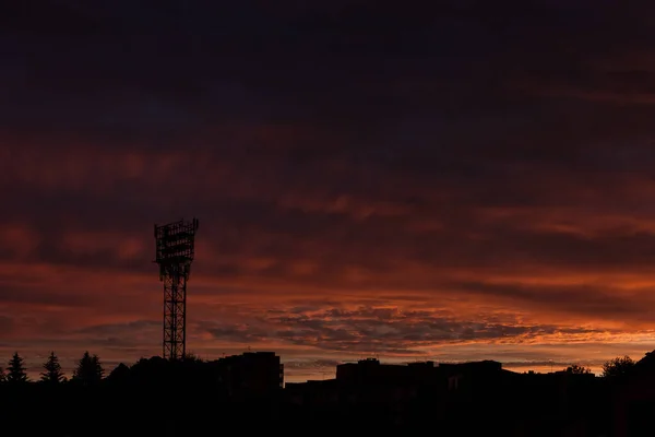 Stadium spotlight on background evening sky. Clouds in the evening sky. Sunset
