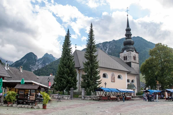 The main square church and mountains in Kranjska gora, Slovenia.