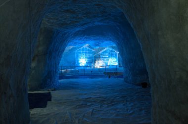A tunnel in the snow in an ice cave under a glacier in the mountains above the town of Zermatt in Switzerland.