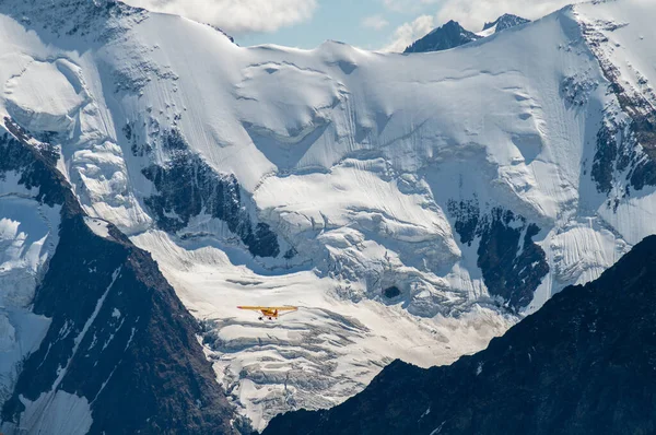 Snowy High Mountains Swiss Alps Small Yellow Plane — Fotografia de Stock