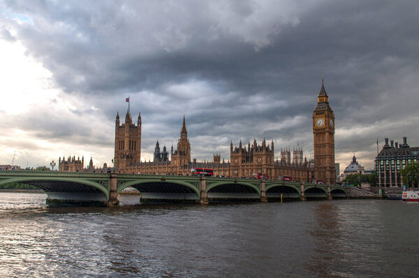The British Parliament, and the Big Bens clock at the Thames River in Westminster