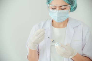 A doctor or scientist is holding a vaccine vial for monkeypox or clade.