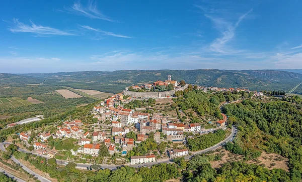 Drone panorama on historical Croatian town Motovun in Istria during daytime with clear sky and sunshine in summer