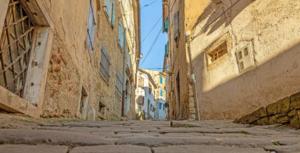 Picture of the romantic cobblestone access road to the historic center of the Croatian town of Motovun in summer
