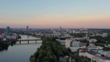 Video panning over Frankfurt am Main skyline during sunset in evening glow