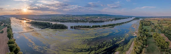 Drone image over the Rhine with record low water level in drought summer 2022 during sunset