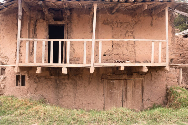 House made of adobe mud in rural countryside in Cusco Peru. Traditional house from the Peruvian Andes.