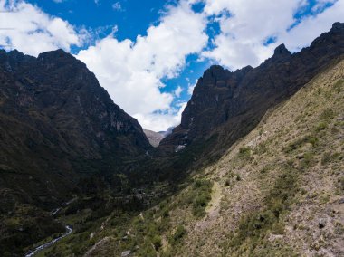 Aerial view of landscapes of Chupani village in middle of the Peruvian Andes. Small community in the Sacred Valley with some ruins and river.