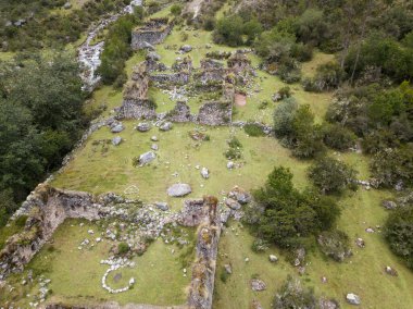 Aerial view of landscapes of Chupani village in middle of the Peruvian Andes. Small community in the Sacred Valley with some ruins and river.