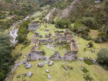 Aerial view of landscapes of Chupani village in middle of the Peruvian Andes. Small community in the Sacred Valley with some ruins and river.