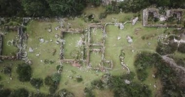 Aerial view of landscapes of Chupani village in middle of the Peruvian Andes. Small community in the Sacred Valley with some ruins and river.