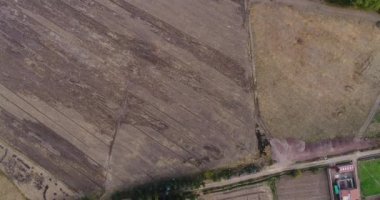 Aerial view of rural fields in Calca city in the Sacred Valley in Cusco Peru. Peruvian high Andes during dry season.