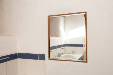 View of a rural bathroom. White room for hygiene in rural house. Bathroom in family home.