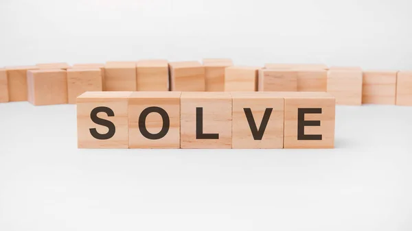 Solve word, text, written on wooden cubes, building blocks, over white background — Stock Photo, Image