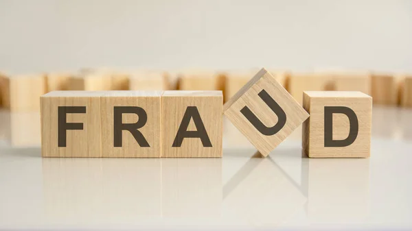 Fraud Word Wooden Blocks Letters Gray Background Reflection Caption Mirrored — Stock Photo, Image