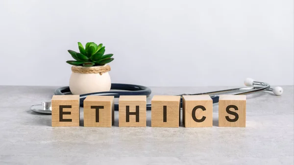 Wooden Block Form Word Ethics Stethoscope Doctor Desktop Medical Concept — Stock Photo, Image