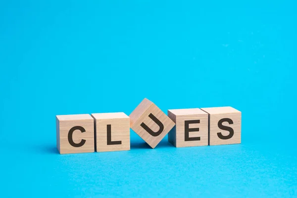 Clues Text Wooden Blocks Financial Business Concept Blue Background — Stock Photo, Image