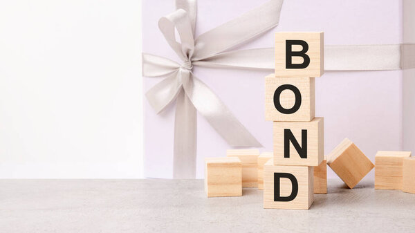 bonds text on a wooden cubes on a white paper background