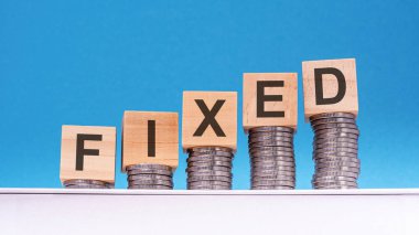 FiXED - para, mavi arkaplan, iş konsepti ile ahşap küp blok yığın metin
