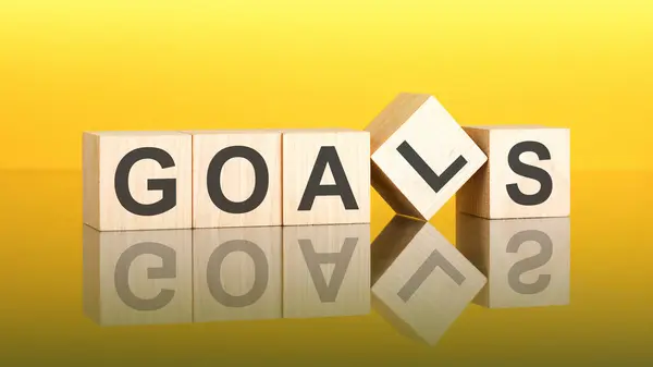 Goals Word Written Wood Block Yellow Background Business Concept Inscription Stock Image