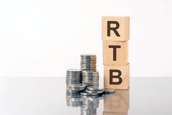 RTB word is made of wooden building blocks lying on the gray table, business concept. RTB acronym Real Time Bidding