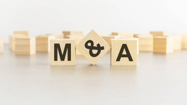 MA - Mergers and Acquisitions - letter pices on the wooden cubes, white background clipart