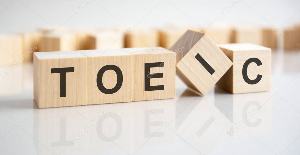 wooden blocks with the text: TOEIC - Test Of English For International Communication