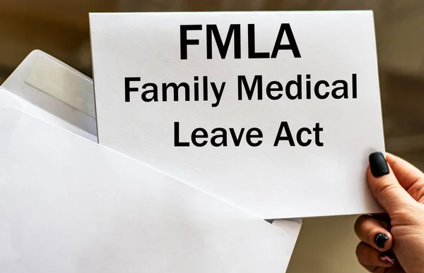 FMLA Family Medical Leave Act words written in letter from envelope