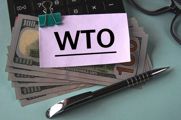 Wto Wereldhandelsorganisatie Acroniem Een Wit Stuk Papier Gefixeerd Bankbiljetten Tegen — Stockfoto