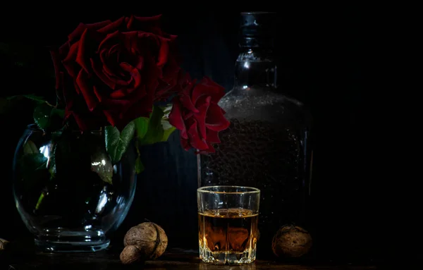 Dusty Bottle Brandy Glass Brandy Some Nuts Roses Glass Vase — Stock Photo, Image