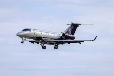Luqa, Malta - January 19, 2022: A private Embraer EMB-550 Legacy 500 (REG: G-WLKR) with a nice dog portrait on the tail fin. clipart