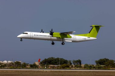 Luqa, Malta - August 16, 2022: Air Baltic Bombardier DHC-8-402 Q400 (REG: YL-BBW) with titles removed coming for service after end of lease with airline.