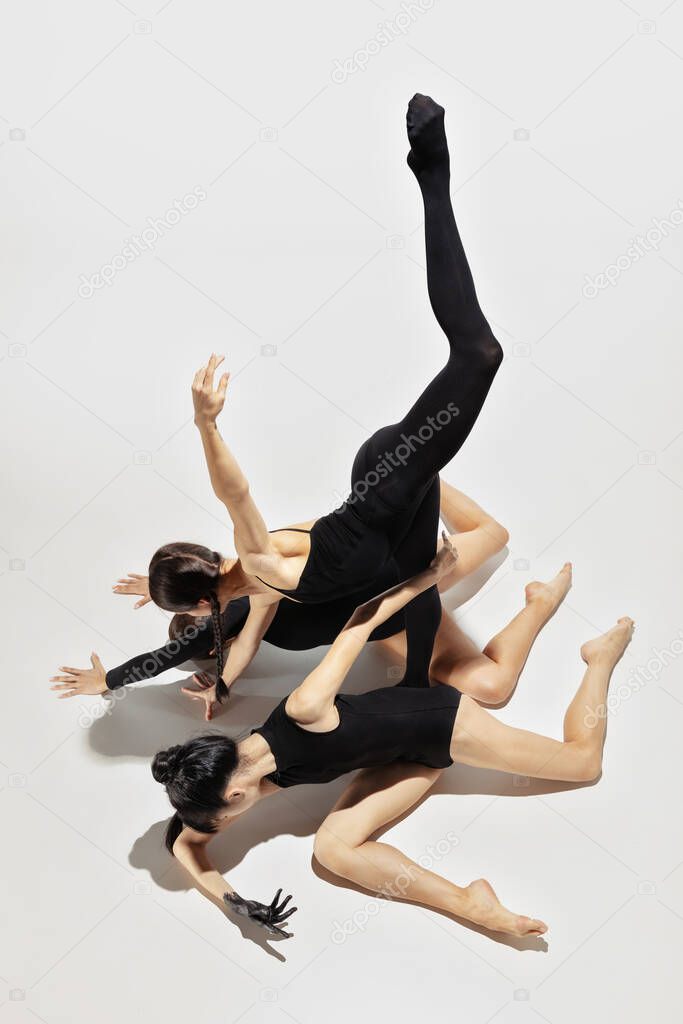 Modern ballet performance. Group of modern dancers, art contemp dance, black and white, combination of emotions