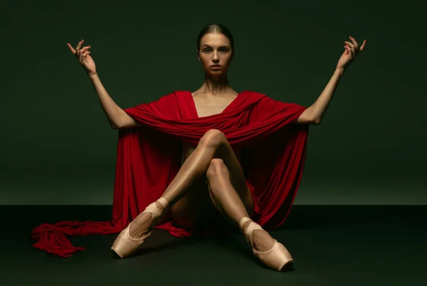 Graceful classic ballerina posing like greek goddess isolated on dark studio background. Grace, art, performance concept. — Stock Photo, Image