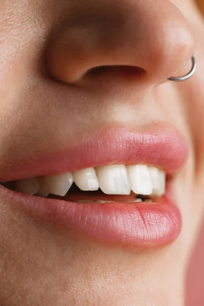 Close-up female mouth and nose isolated over pink studio background. Natural beauty concept. Dental health concept — Stock Photo, Image