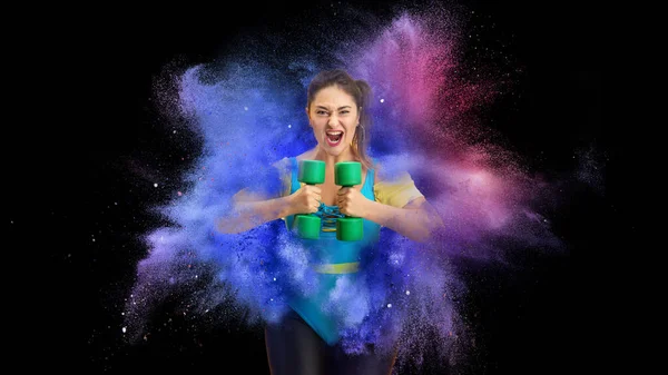 Collage con atleta joven, entrenador de fitness posando en explosión de polvo de neón de color aislado sobre fondo oscuro —  Fotos de Stock