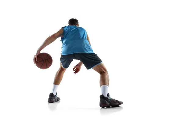 Back view of professional basketball player in blue sports uniform training isolated on white studio background. — Stock Photo, Image