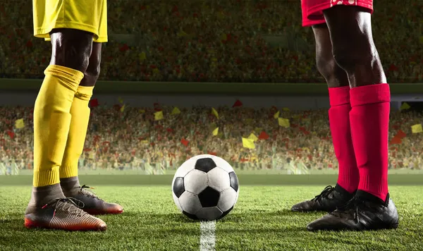Cropped image of two male soccer, football players standing at crowded stadium at beginning of sport match. — Stock Photo, Image
