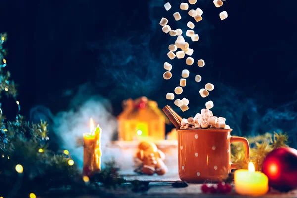 Greeting card design. Cup of hot cocoa with flying marshmallows and festive candles. Cozy, happy home holiday atmosphere. — Stock Photo, Image